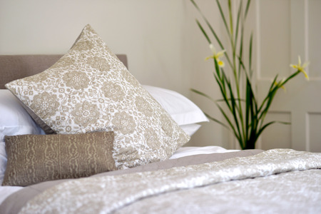 Bedroom setting with luxury pillows, shams and duvetsの写真素材