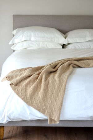 Bedroom setting with luxury pillows, shams and duvetsの写真素材