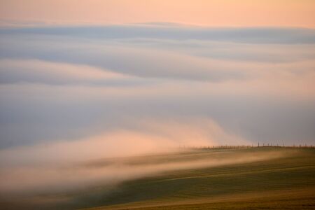 Low cloud on the South Downs at sunsetの写真素材