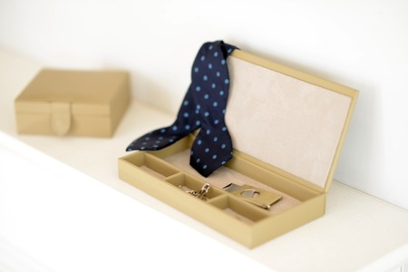 Brown leather box with bow tie cigar cutter and cufflinksの写真素材