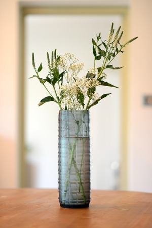 blue, straight sided decorative glass vase with checker pattern.の写真素材