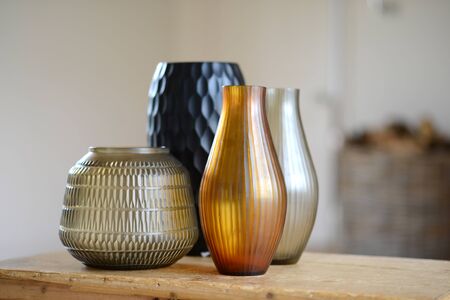 Group of four decorative cut glass vases in a roomの写真素材