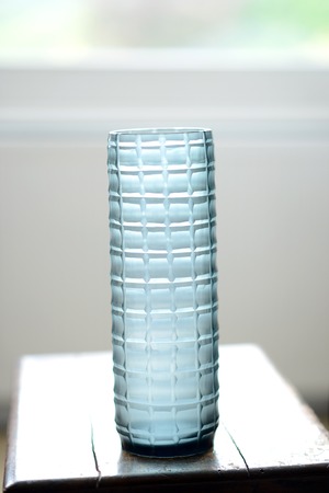 blue, straight sided decorative glass vase with checker pattern.の写真素材