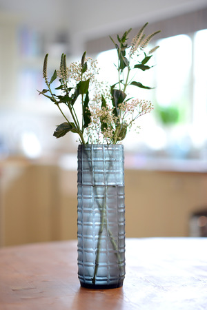 blue, straight sided decorative glass vase with checker pattern.の写真素材
