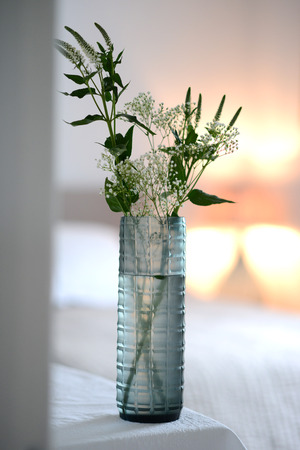 blue, straight sided decorative glass vase with checker pattern.の写真素材