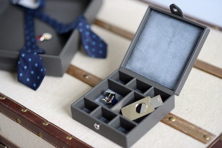 Brown leather box with bow tie cigar cutter and cufflinksの写真素材