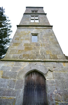 Ancient oak door in a stone built towerの写真素材