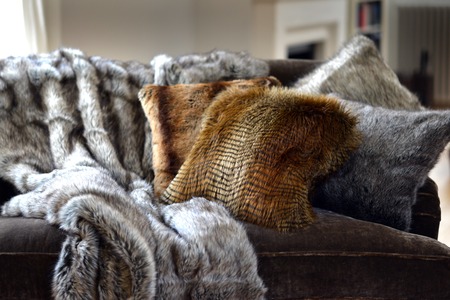 Faux fur throws and cushions room interiorの写真素材