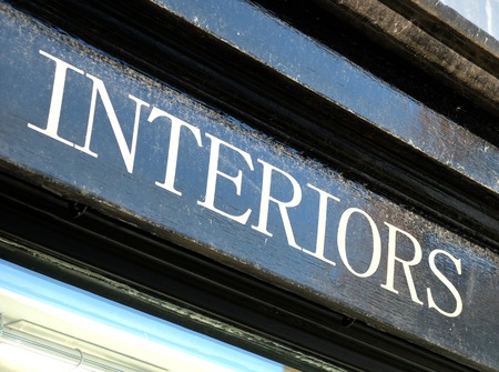 Sign saying interiors painted on blackの写真素材