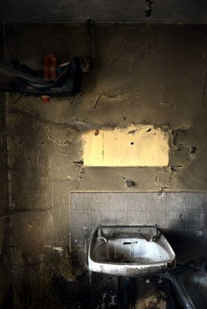 Damage to a bathroom after a house fireの写真素材