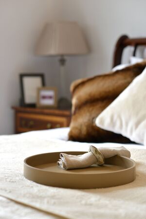 Fawn leather tray in a bedroom settingの写真素材