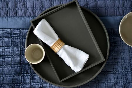 Dark brown leather tray in a blue bedroomの写真素材