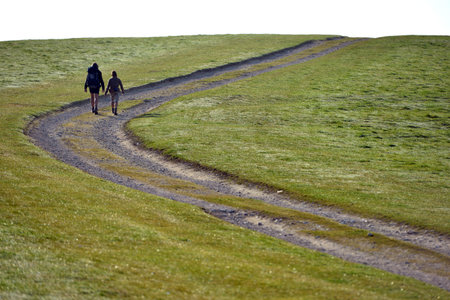 Couple walking on the South Downs Way in Sussex