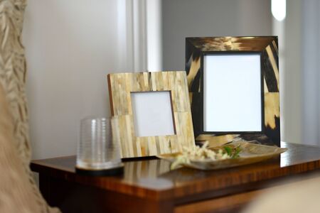 natural horn picture frames in a bedroom settingの写真素材