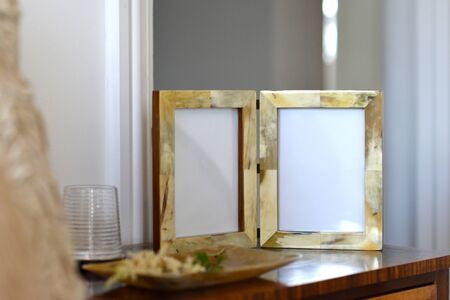 natural horn picture frames in a bedroom settingの写真素材