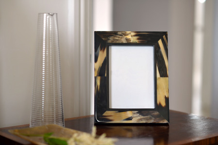 natural horn picture frames in a bedroom settingの写真素材