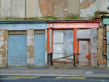 Derelict and boarded up shops in Liverpool, UKのeditorial素材