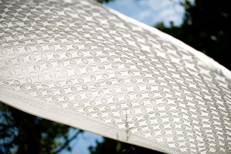White sheet / table cloth draped in a gardenの写真素材