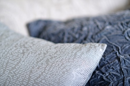 Details on textured and quilted sofa cushionsの写真素材