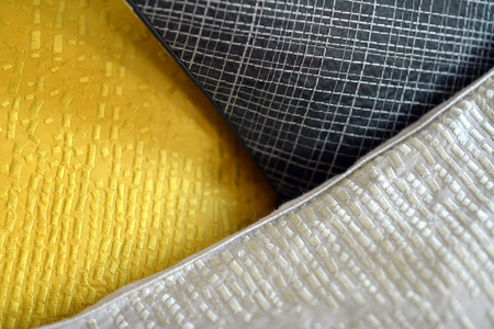 Details on textured and quilted sofa cushionsの写真素材