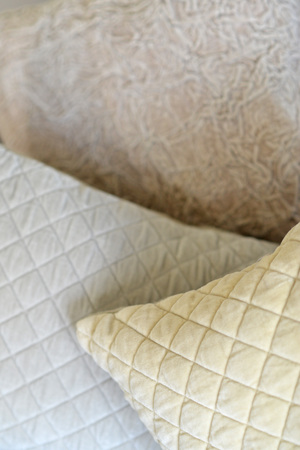 Details on textured and quilted sofa cushionsの写真素材