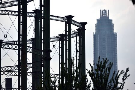 Old gas holders in London with modern buildingsの写真素材