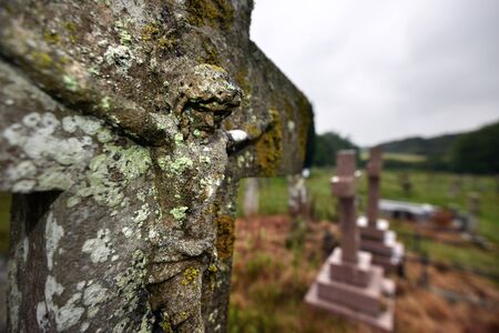 Craved figure of Jesus on an old gravestoneの写真素材