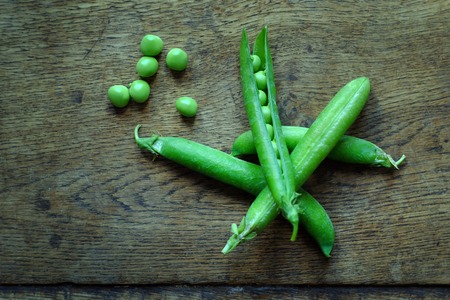 Fresh shell on peas with pea podsの写真素材