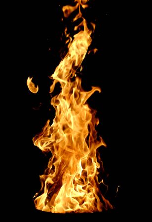 Sparks and flames erupt from a fireの写真素材