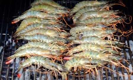 Large prawns, or shrimp, cooking on a BBQの写真素材