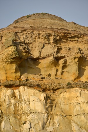 Weathered and eroding sandstone over chalkの写真素材