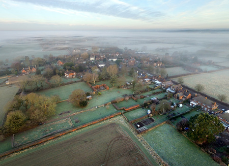 Small English village on a frosty and misty morningの写真素材