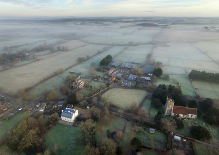Small English village on a frosty and misty morningの写真素材