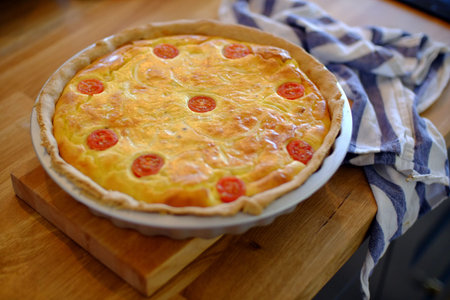 Home baked cheese and tomatoe quiche / flanの写真素材