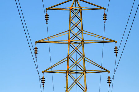 Elelctricity pylon in sun with blue sky