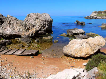 This picture was taken in summer in licatese territory, a town near Agrigento and Gela. You can appreciate the natural elements, with intense colors and shimmering sea to the hills rich in vegetation That slope down to the water.の写真素材
