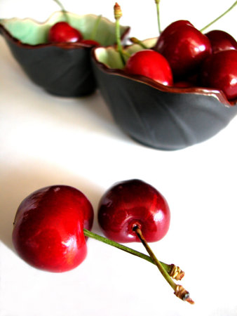 Red cherries and bowlの写真素材