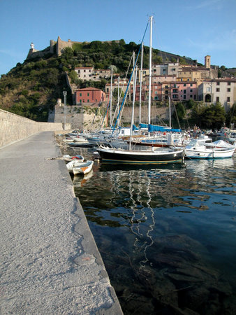 Village view from harbour, Porto Ercole in Tuscany, Italyの写真素材