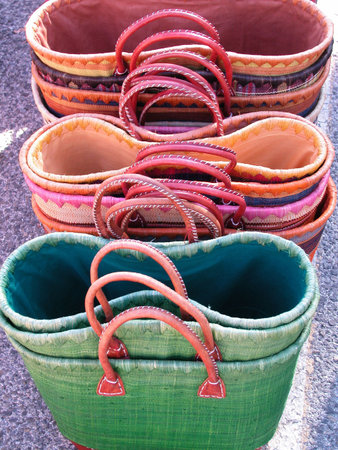 Straw colored handmade bags in a sunny day