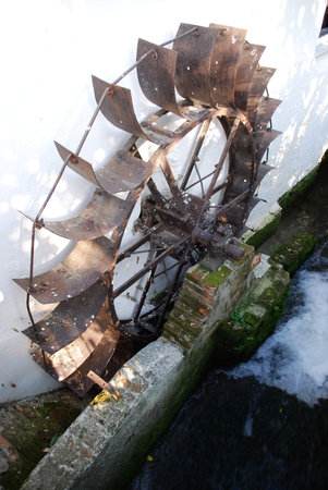 Old mill and narrow water river stream in countrysideの写真素材