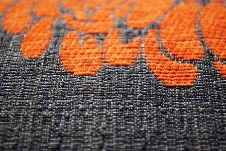 Gray and orange fabric texture macro detail background horizontalの写真素材