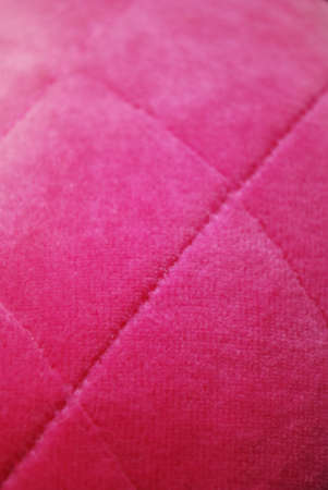 Pink padded velvet fabric texture macro background verticalの写真素材