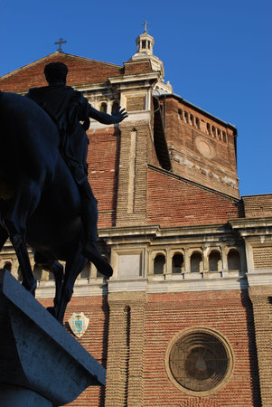 Equestrian statue of Regisole and Pavia cathedral on blue sky, Lombardy, Italy