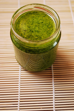 Fresh basil pesto, typical italian green sauce dressing for pasta
