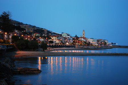 Small village on Mediterranean sea at dusk, Santo Stefano al Mare, Liguria, Italy の写真素材