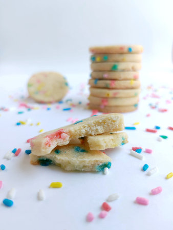 Cookies with colorful sprinkles on a white background. Selective focus.の写真素材