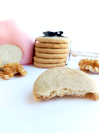 Biscuits and a jar of honey on a white background.の写真素材