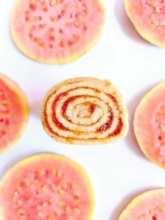 Closeup of guava jam roll on white background with copy spaceの写真素材