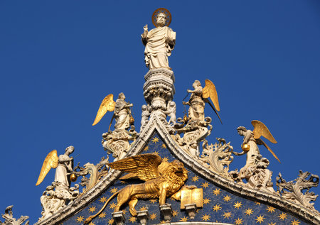 Beautiful spires, freizes, and statues of San Marco in Veniceの写真素材