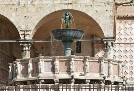 Beautiful gothic fountain in the medieval centre of Perugiaの写真素材
